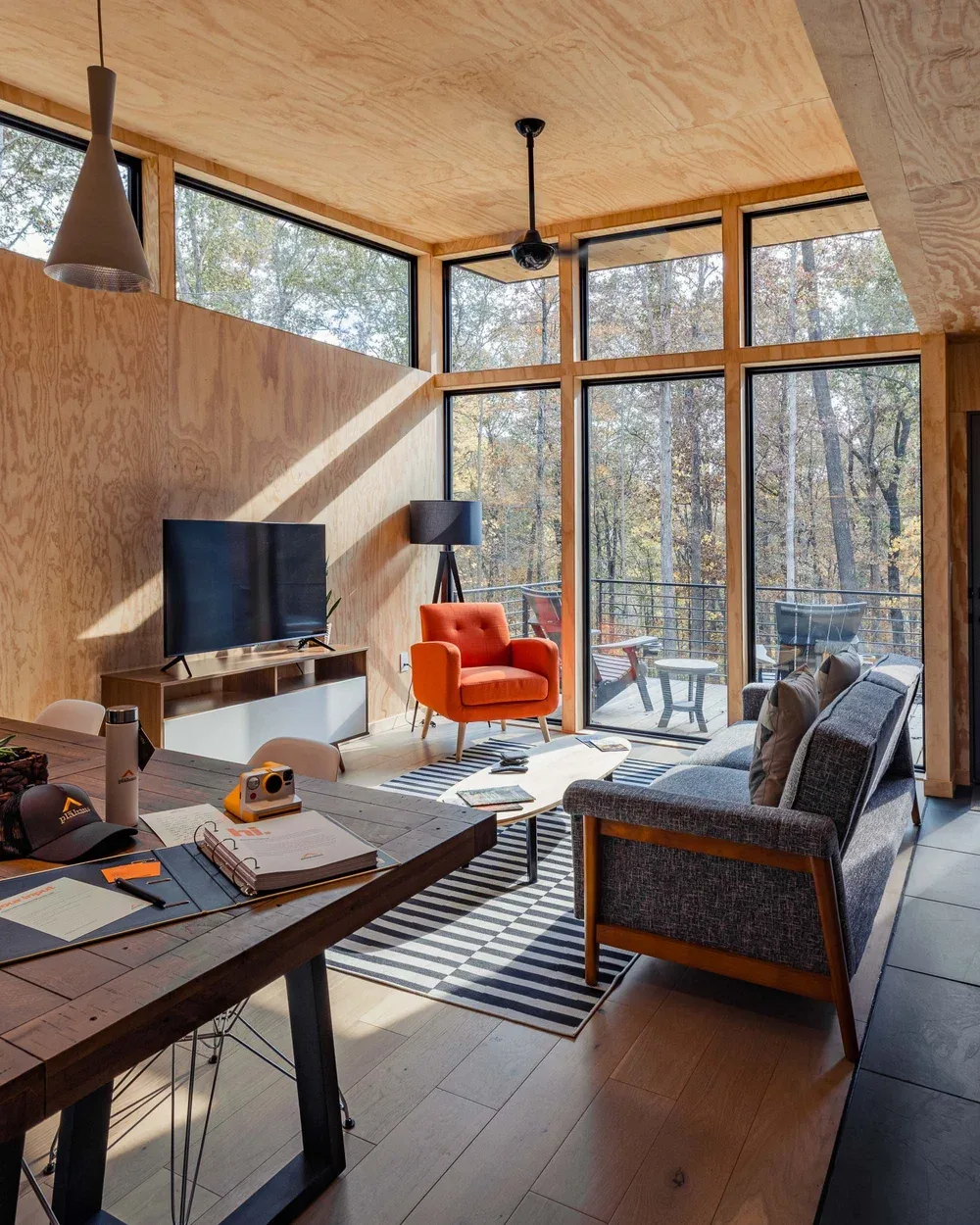 PlaHaus interior with floor-to-ceiling window wall