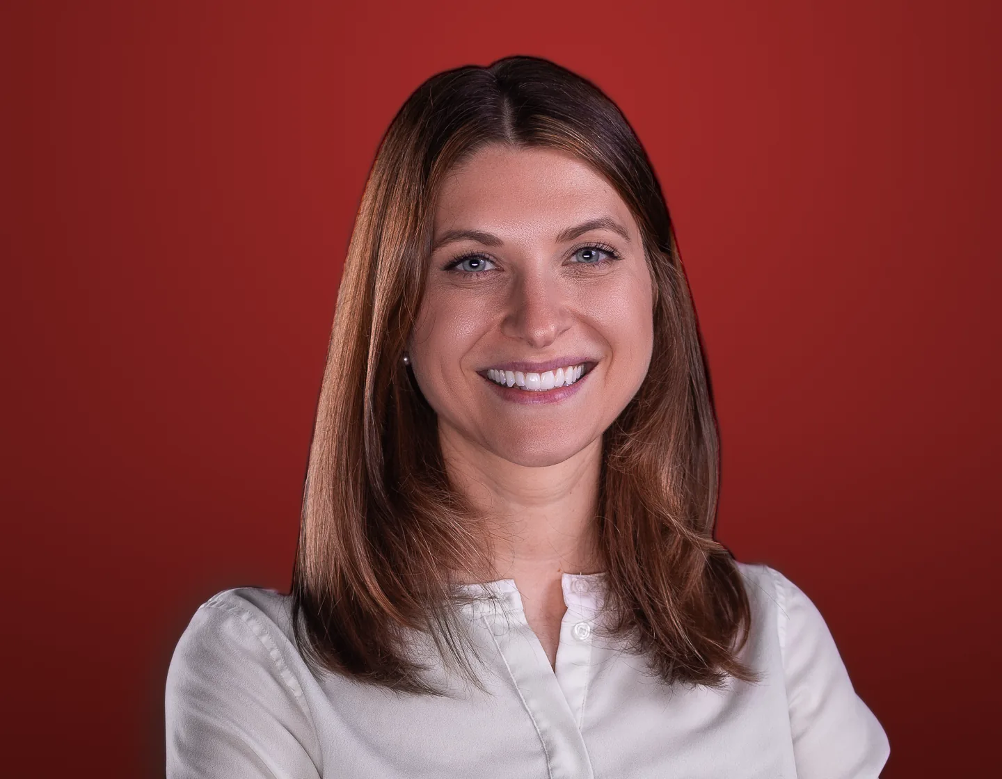 Corporate headshot on a red backdrop